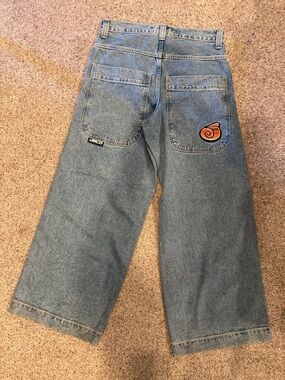 JNCO Relaxed Wide-Leg Blue Denim Jeans with Orange Swirl Patch